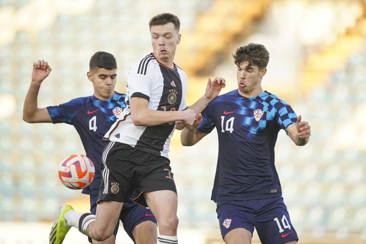 Ivan Cvetko (L) and Luka Vuskovic of U19 Croatia in action against Tom Bischof of U19 Germany during the UEFA Under19 European Championship Qualifi...