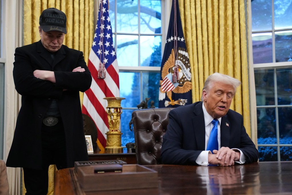 Elon Musk and President Trump  during an executive order signing in the Oval Office at the White House on Feb. 11, 2025.