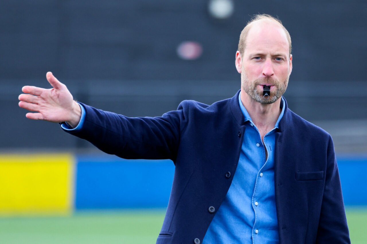 The Prince Of Britain's Prince William, Prince of Wales lows the referee's whistle during a mini football game as part of his visit to the FA Refer...