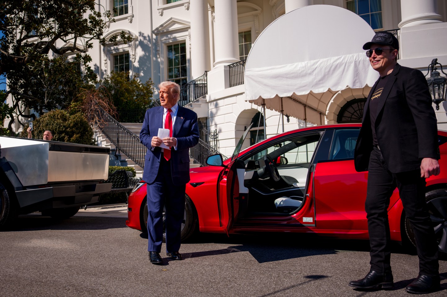 WASHINGTON, DC - MARCH 11: U.S. President Donald Trump, accompanied by White House Senior Advisor, Tesla and SpaceX CEO Elon Musk, speaks as they look at a Tesla Cyber Truck and a Model S on the South Lawn of the White House on March 11, 2025 in Washington, DC. Trump spoke out against calls for a boycott of Elon Musk's companies and said he would purchase a Tesla vehicle in what he calls a 'show of confidence and support' for Elon Musk.