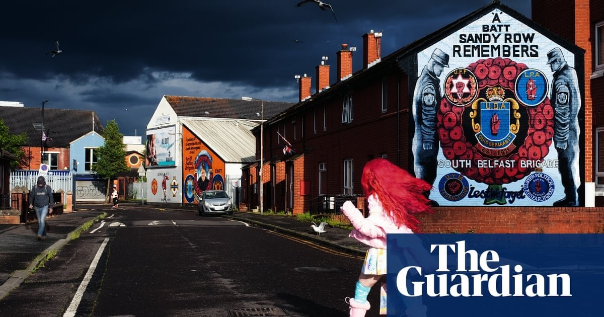 Flame-haired defiance by a Belfast mural: Hannah Starkey’s best photograph