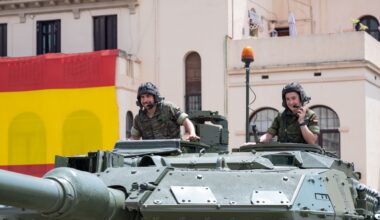 Barcelona, Spain; June 1, 2024: Detail of two smiling tank soldiers peeking out of the hatches of the turret of the Leopard tank at the Bruch barracks.