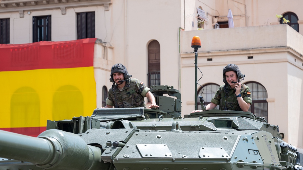 Barcelona, Spain; June 1, 2024: Detail of two smiling tank soldiers peeking out of the hatches of the turret of the Leopard tank at the Bruch barracks.