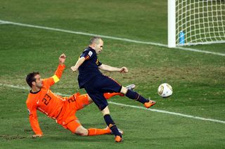 JOHANNESBURG, SOUTH AFRICA - JULY 11: Andres Iniesta of Spain scores during the 2010 FIFA World Cup South Africa Final match between Netherlands and Spain at Soccer City Stadium on July 11, 2010 in Johannesburg, South Africa. (Photo by Jeff Mitchell - FIFA/FIFA via Getty Images)