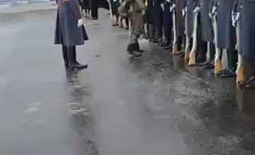 Russian federal security officer checking the President's guardians for explosive and weapons before Putin visit in Murmansk