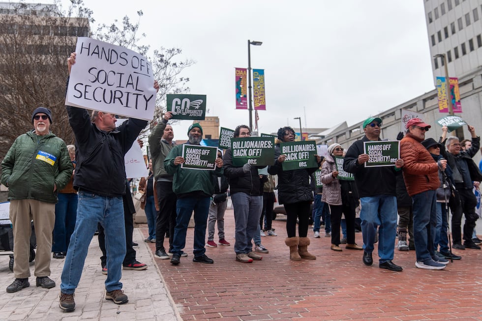 Demonstrators gather outside of the Edward A. Garmatz United States District Courthouse in...