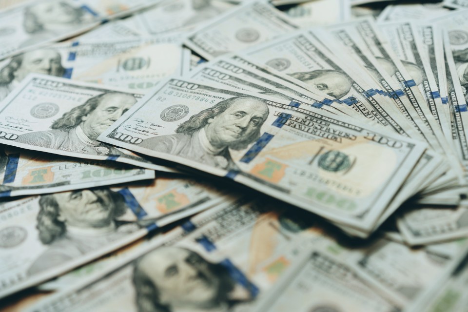 A pile of one hundred dollar bills.