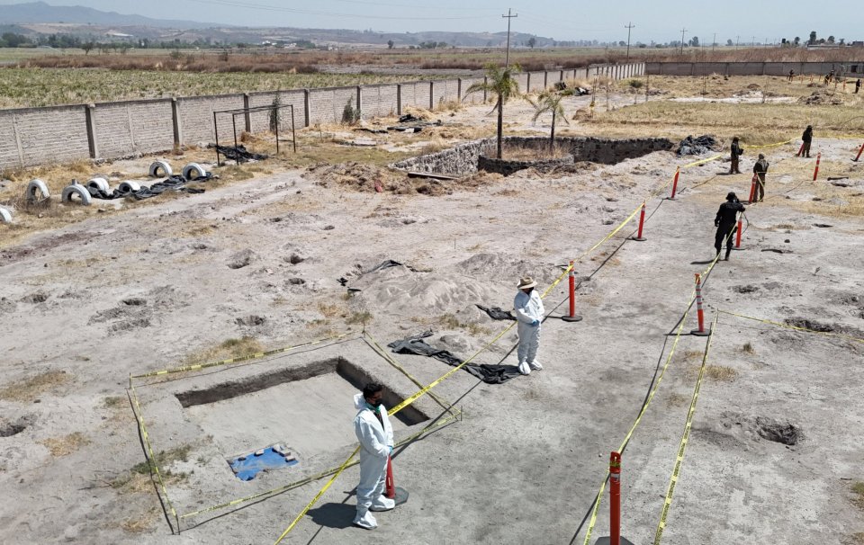 Aerial view of forensic personnel at a crime scene in Mexico.