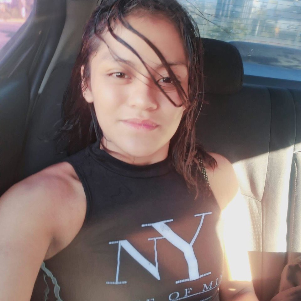 Photo of a young woman in a car.
