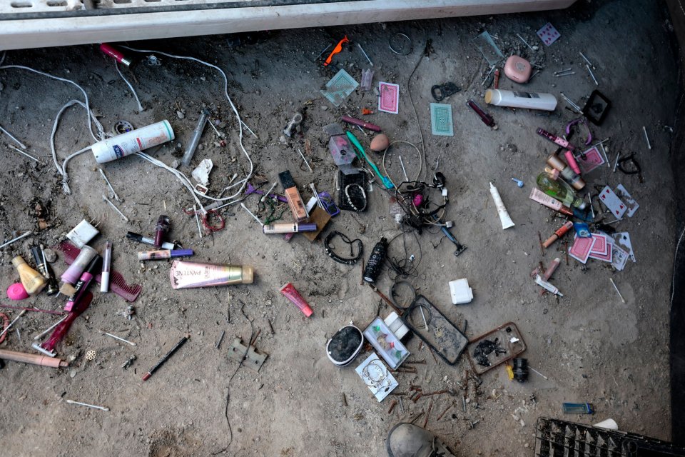 Scattered personal belongings found at a clandestine crematorium site in Jalisco, Mexico.