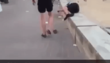 A tourist defecates on a sleeping Spanish man.