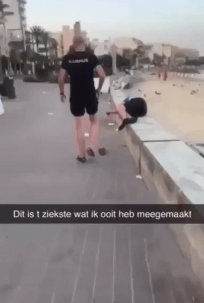A tourist defecates on a sleeping Spanish man.
