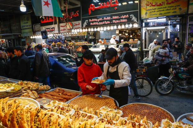 FILE.- A boy buys sweets on the first day of...