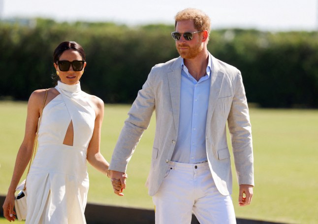 FILE PHOTO: Britain's Prince Harry and Meghan, Duchess of Sussex attend the Royal Salute Polo Challenge to benefit Sentebale, a charity founded by him and Prince Seeiso of Lesotho to support children in Lesotho and Botswana, in Wellington, Florida, U.S., April 12, 2024. REUTERS/Marco Bello/File Photo