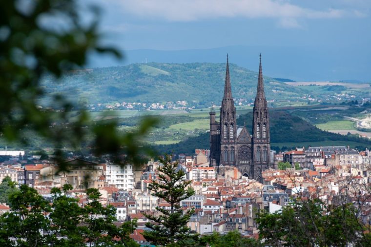 Distant view of the Notre-Dame-de-l'Assomption Cathedral in Clermont-Ferrand, France, built in black Volvic stone, in the French department of Puy-de-D??me, in the Auvergne Rh??ne-Alpes region