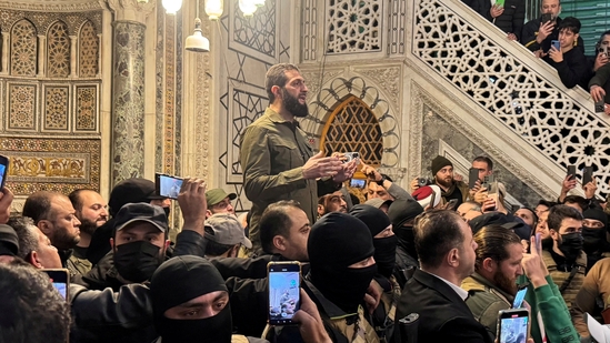 Syrian rebel chief Abu Mohammed al-Golani speaks to a crowd at Ummayad Mosque in Damascus after Assad's fall. (Reuters)