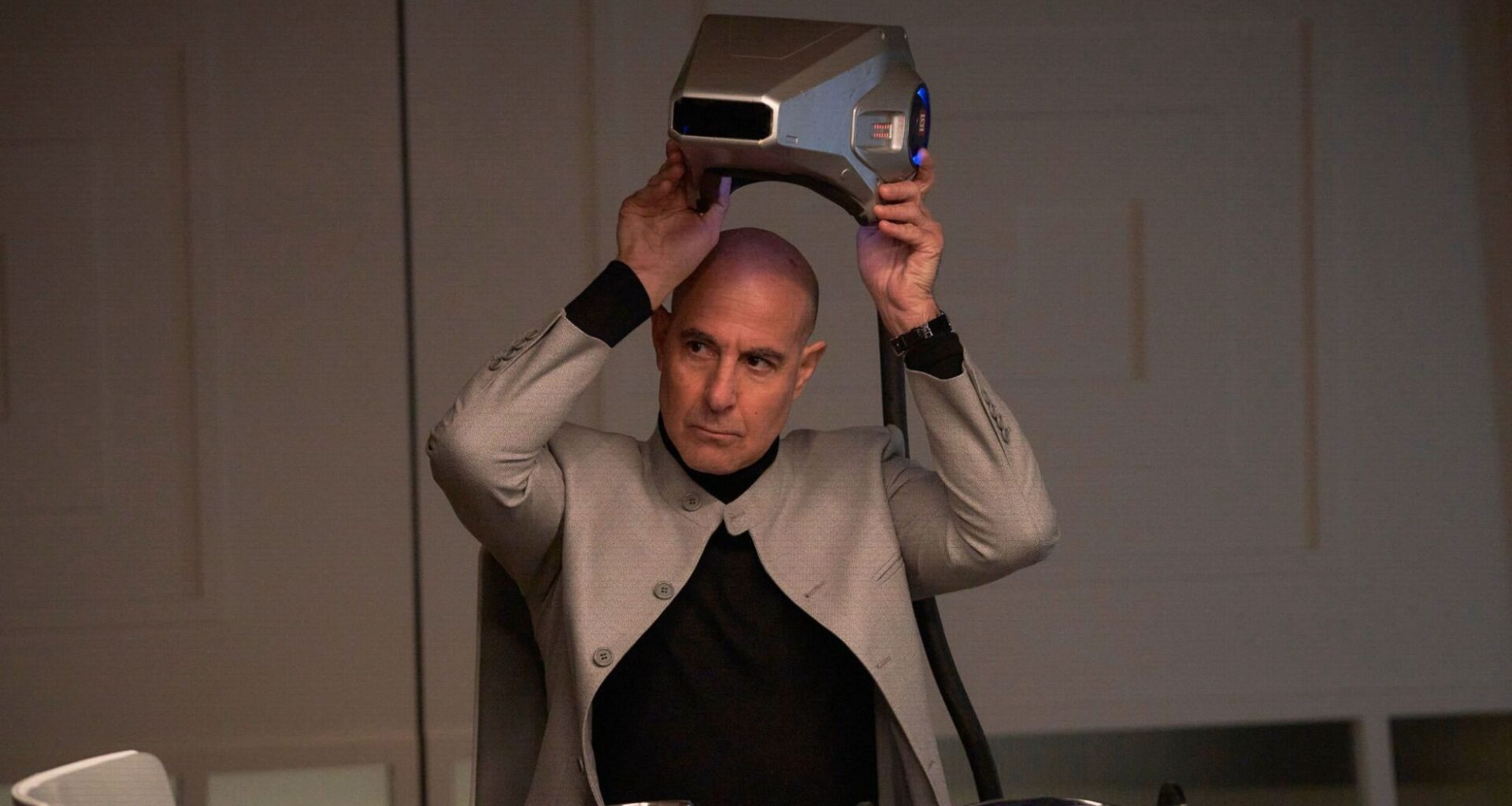 Stanley Tucci as Ethan Skate in The Electric State