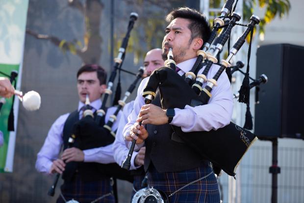 Bagpipers with the City of Angels Pipe Band perform during...
