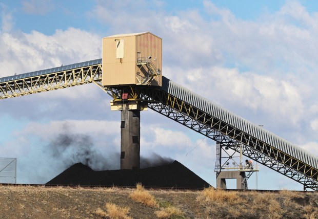 Strong winds blow coal dust from a coal pile at the Comanche Generating Station in Pueblo on March 4, 2025. This coal-fired power plant is a significant source of air pollution and greenhouse gas emissions in the state. (Photo by RJ Sangosti/The Denver Post)