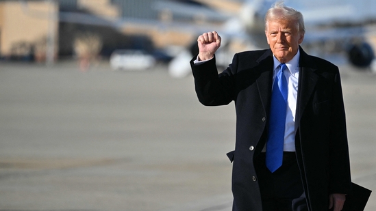 US President Donald Trump pumps his fist as he walks to board Air Force One at Joint Base Andrews in Maryland.(AFP file photo)