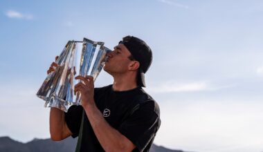 2025 BNP Paribas Open Men's Singles Champion Jack Draper poses for a photo with the trophy after winning the event in Indian Wells, Calif., Sunday, March 16, 2025.