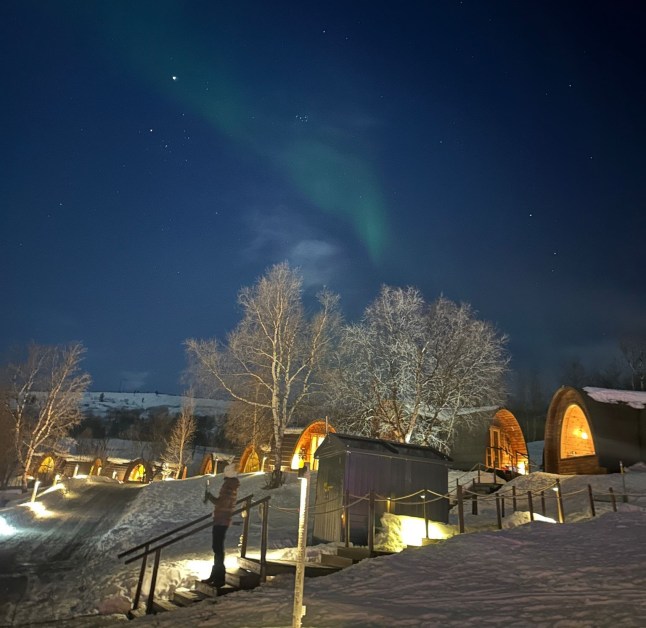 The Northern Lights are seen over the sky at the snow hotel in Kirkenes