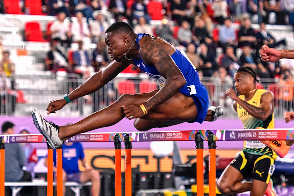 Reminder: Those hurdles are 42 inches (aka 3.5 feet) tall. (Wang Zhao/AFP via Getty Images)