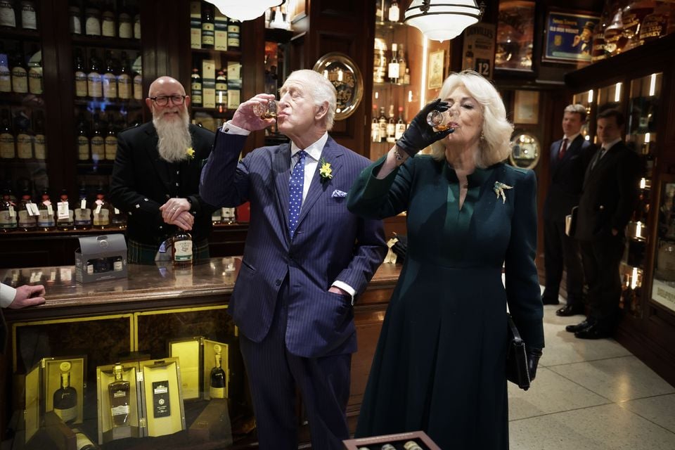 The King and Queen are pictured trying a whiskey with Willie Jack at The Friend at Hand in Belfast. 

Photo by Kelvin Boyes / Press Eye.
