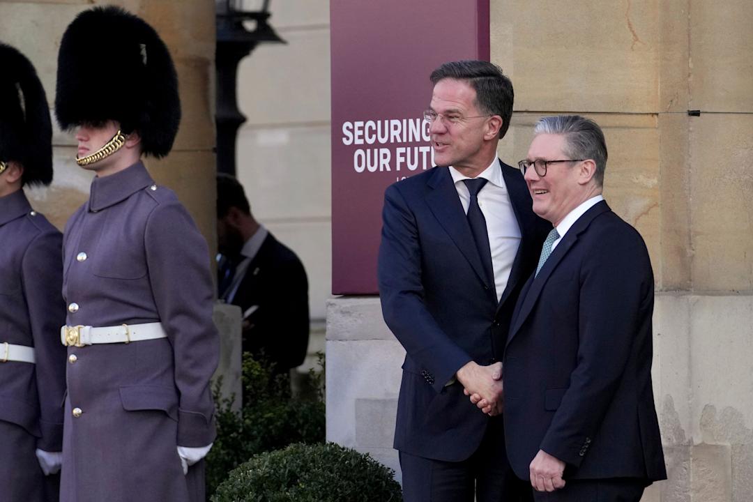 Britain's Prime Minister Keir Starmer, right, greets NATO Secretary General Mark Rutte as he arrives for a summit on Ukraine at Lancaster House in London, Sunday, March 2, 2025. (AP Photo/Christophe Ena, Pool)