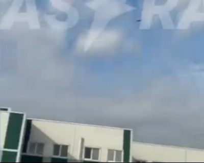 Skywriting of Astra logo above a building.
