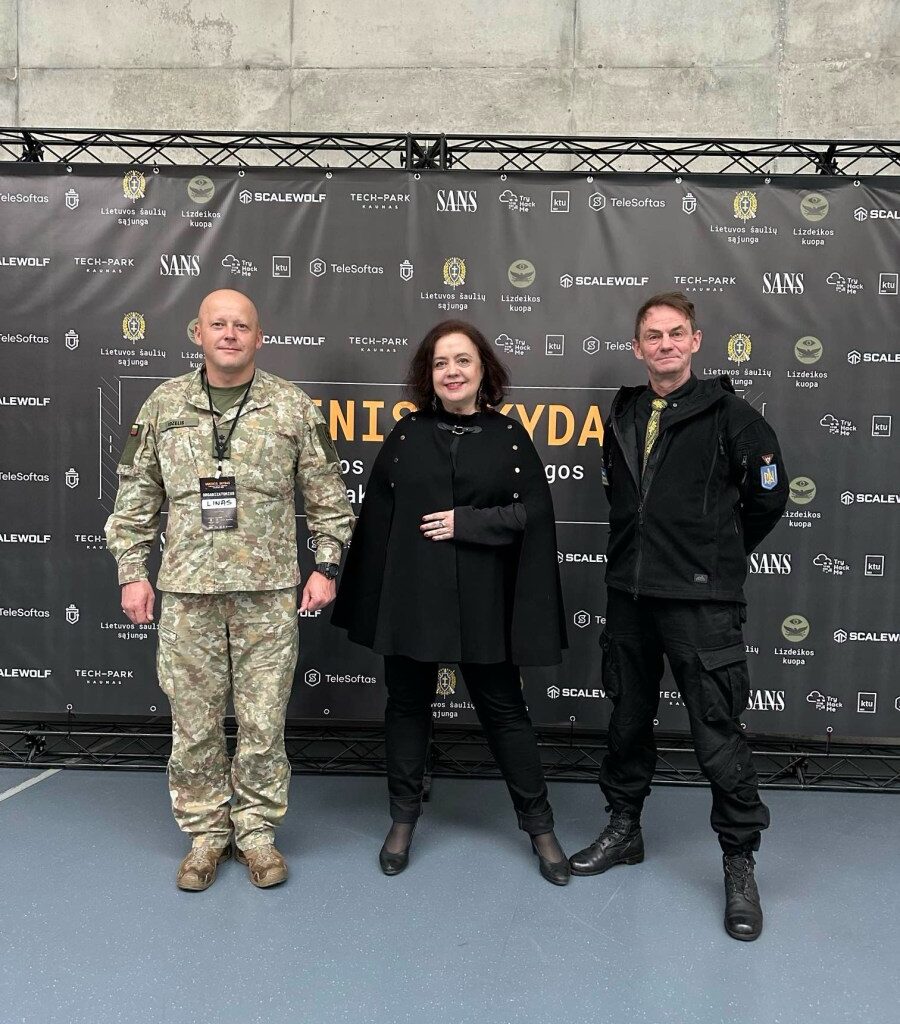 Coinvest Capital managing partner Viktorija Trimbel with Lieutenant Colonel Linas Idzelis (in uniform) and Lieutenant Colonel (retired) Valerijus Šerelis at the 'Fire Shield' hackathon