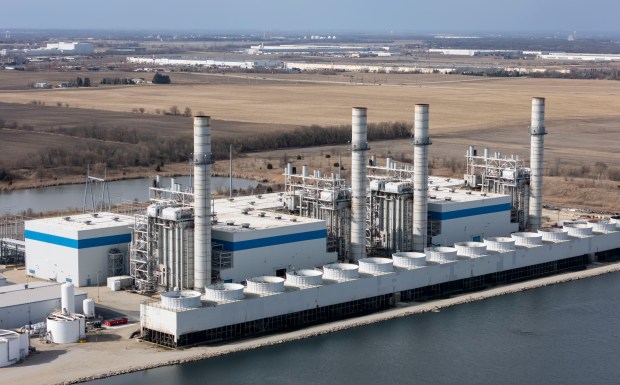 Out their back window, the Robert's family often see steam rising from a Vistra Corp. natural gas power plant just a few hundred yards away, March 19, 2025. (Brian Cassella/Chicago Tribune)