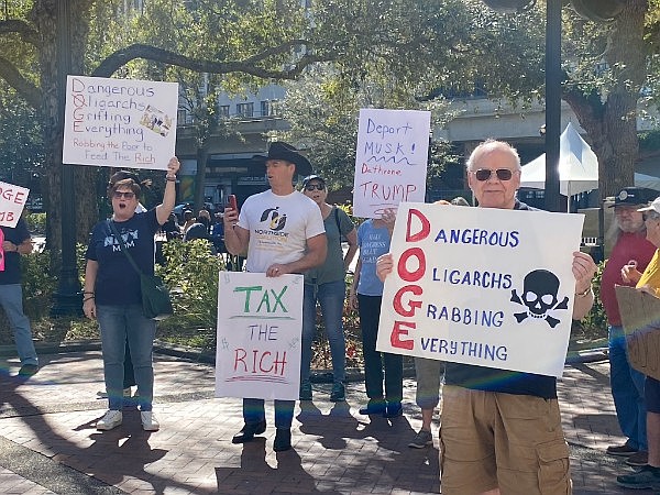 Citizens protest Trump administration’s Department of Government Efficiency before a meeting at City Hall on March 11 to start a Jacksonville version of the national effort.