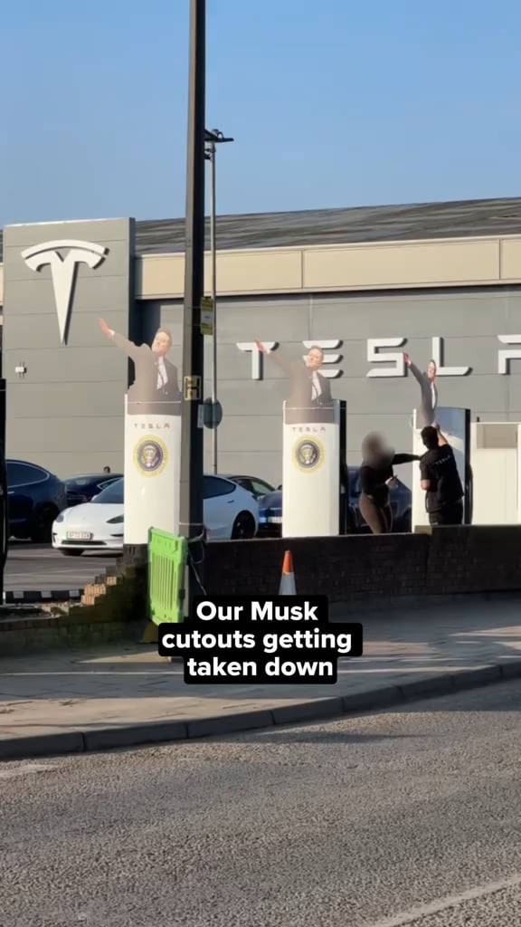 Elon Musk Cut Outs with Trump Seals Getting Taken Down in London
