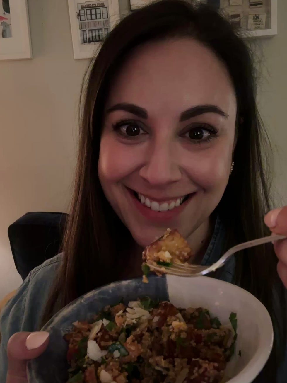 writer jessica wrubel eating a bowl of quinoa romesco and tempeh, a recipe from the wh high protein meal prep manual