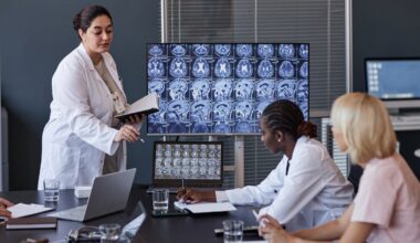 Female neurologist giving report on patient treatment showing brain MRI.