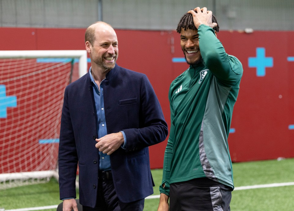Prince William with Aston Villa's Tyrone Mings at a training ground.
