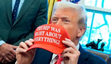 US President Donald Trump holds a hat reading ‘Trump was right about everything’ after signing Executive Orders in the Oval Officea