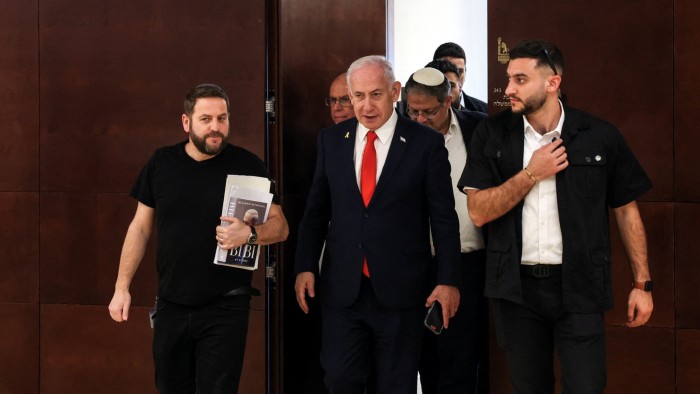 Israeli Prime Minister Benjamin Netanyahu followed by national security minister Itamar Ben-Gvir