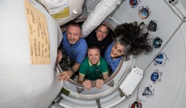 NASA's SpaceX Crew-9 members pose together for a portrait inside the vestibule between the International Space Station and the SpaceX Dragon crew spacecraft. Clockwise from left, are NASA astronauts Butch Wimore, Nick Hague, and Suni Williams, and Roscosmos cosmonaut Aleksandr Gorbunov.