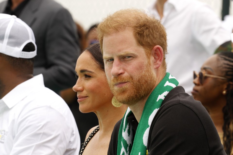 Prince Harry and Meghan, Duchess of Sussex, at an Invictus Games sitting volleyball match.