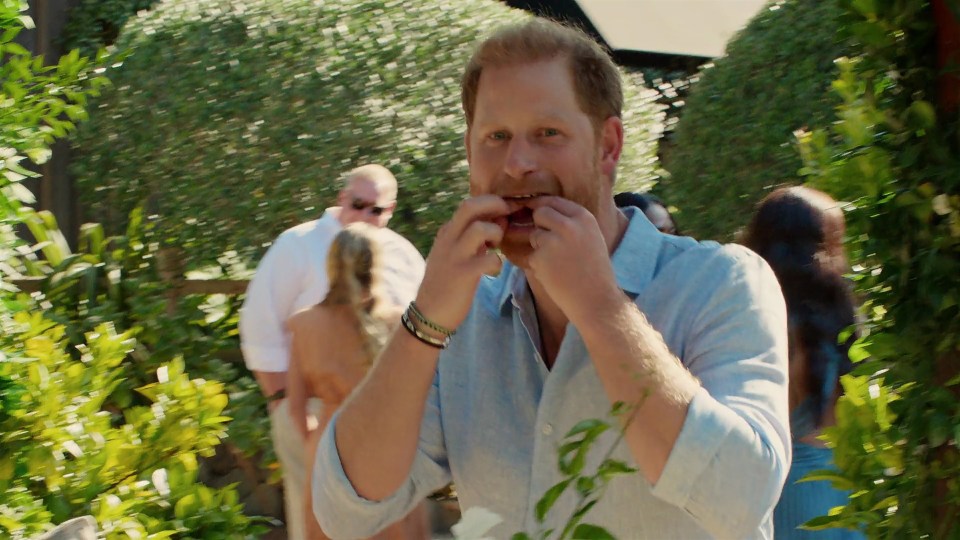 Prince Harry eating on "With Love, Meghan" set.