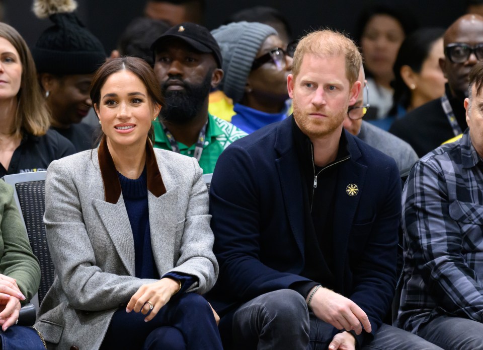 Meghan Markle and Prince Harry at a wheelchair basketball match.