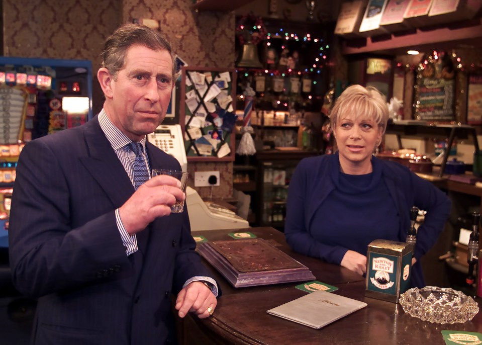 Prince Charles having a drink with an actress in a pub.