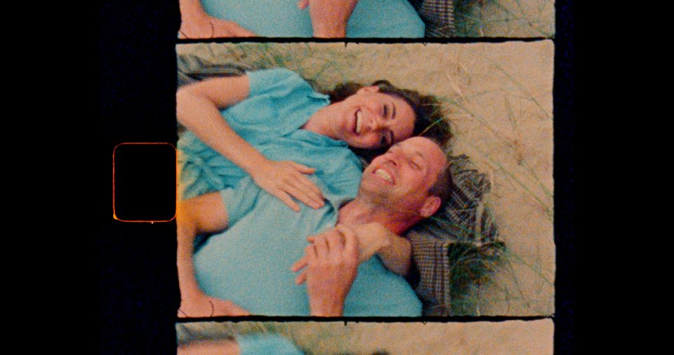 a man and a woman are laying on top of each other on the ground