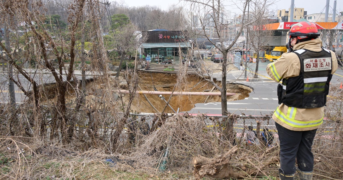 Motorcyclist swallowed by sinkhole in South Korea's capital found dead