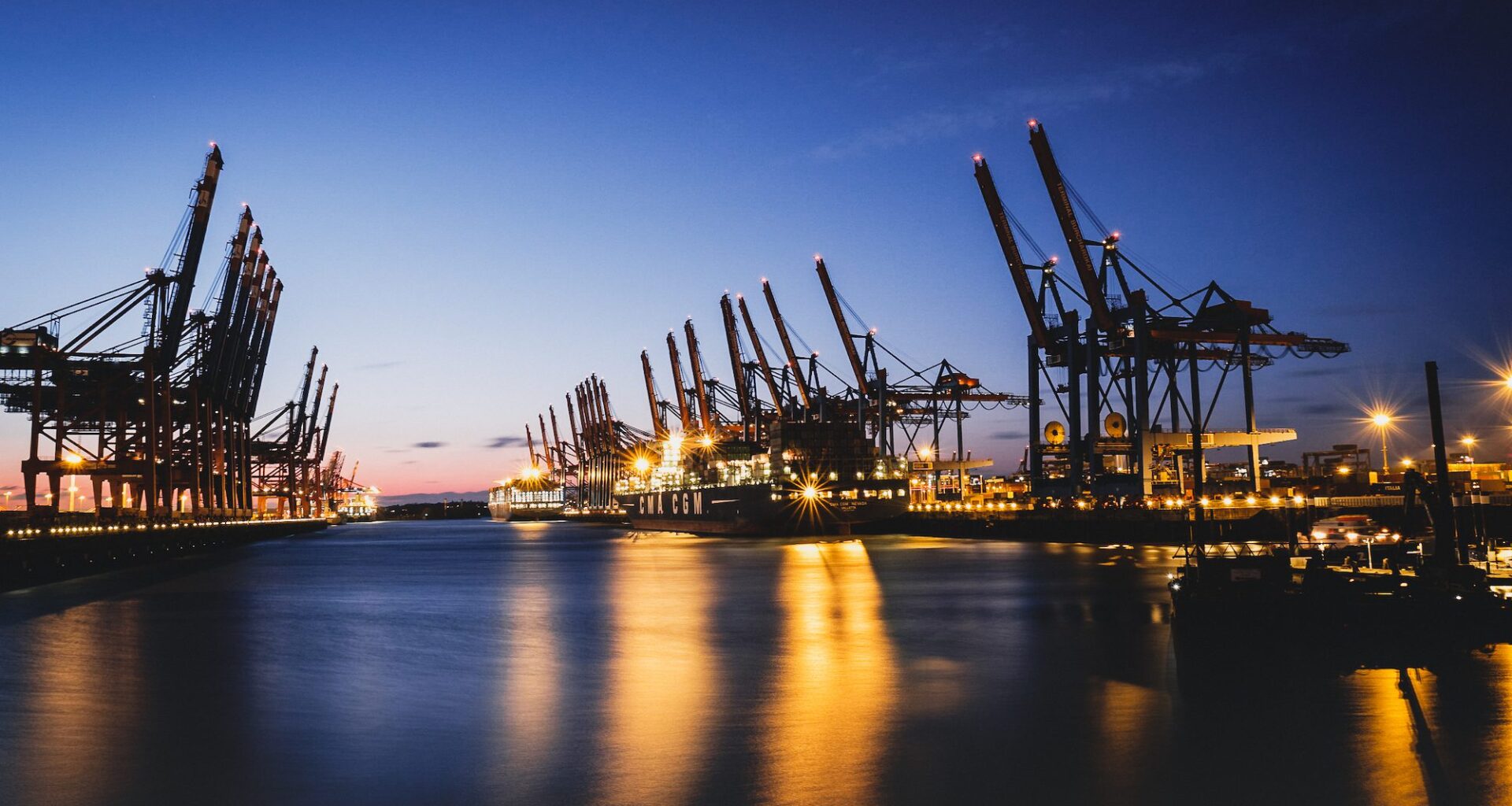 Port cranes at dusk