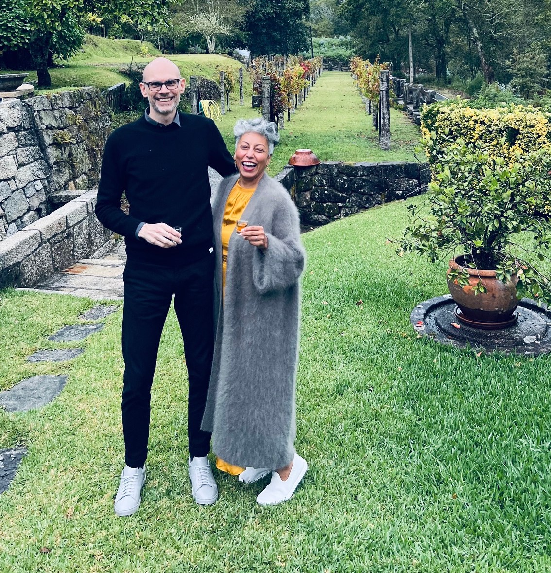 Munawar Ahmed and Stephen Schnepf standing in a vineyard.