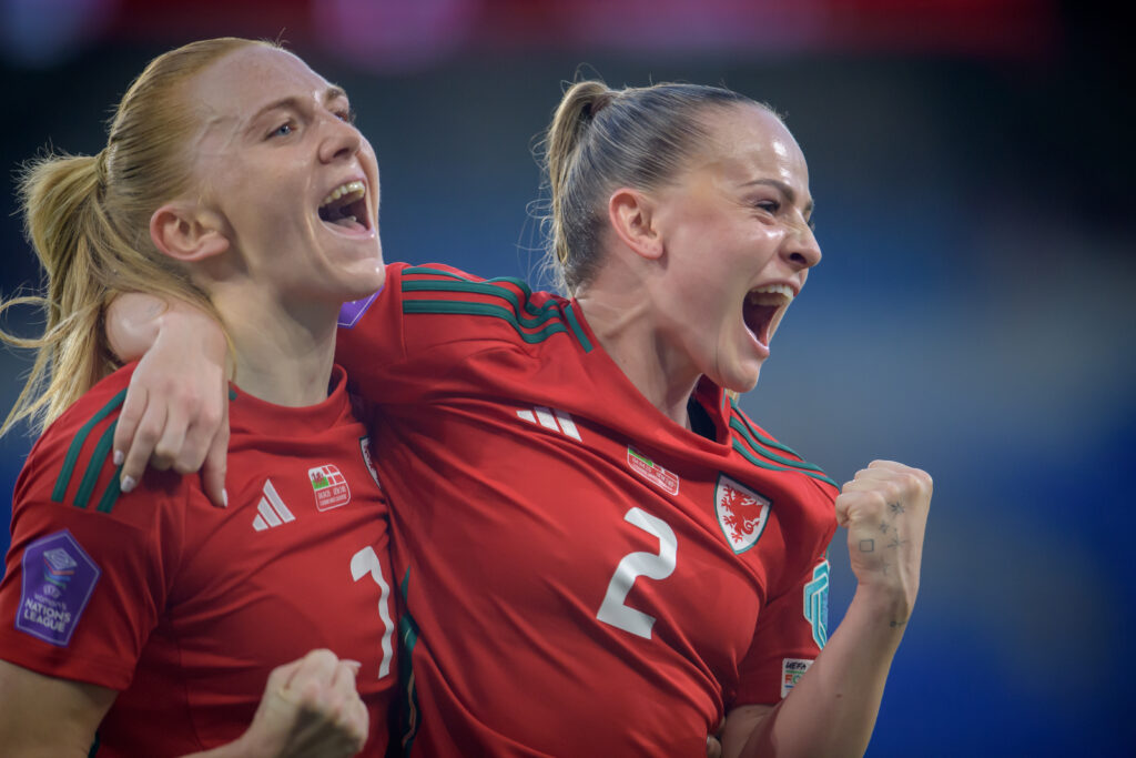 Ceri Holland celebrates with Lily Woodham after scoring for Wales against Denmark in the UEFA Nations League