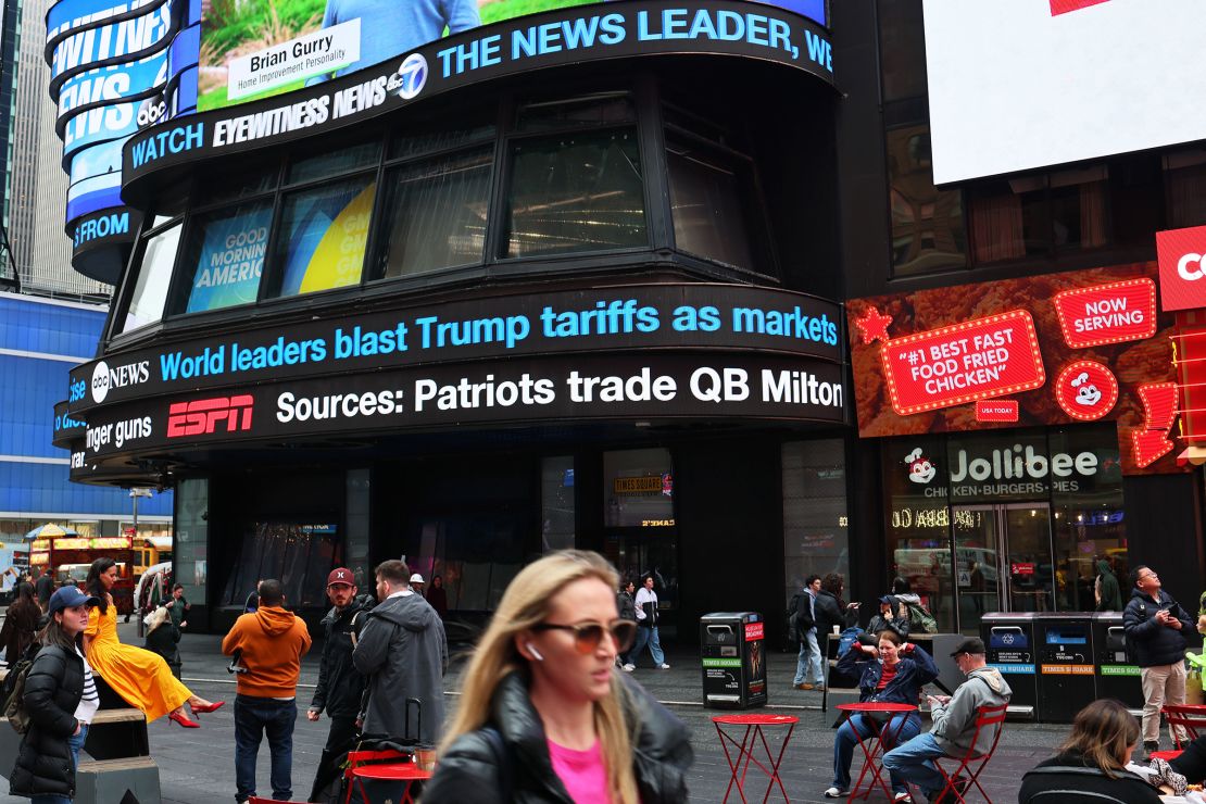 News on President Donald Trump's tariff's are seen displayed in New York's Times Square on Thursday.